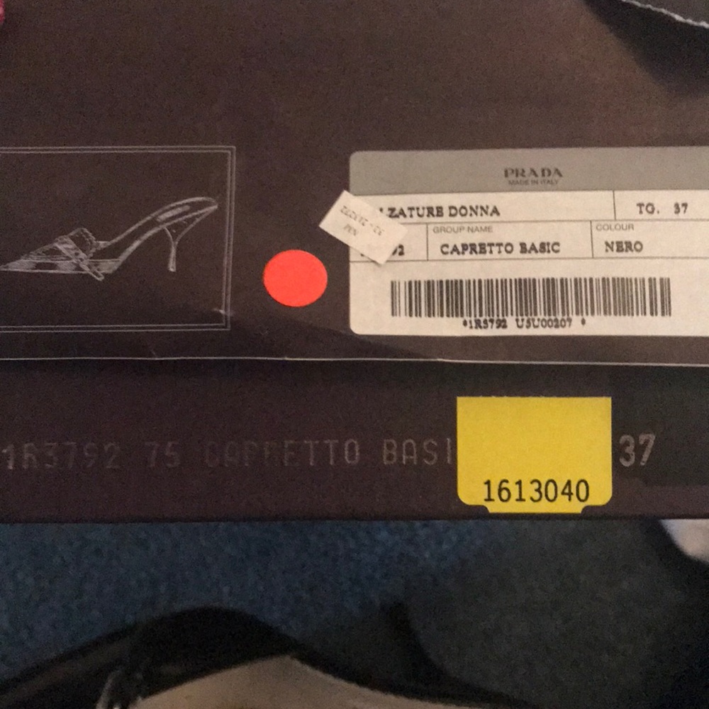 Black leather Prada slides